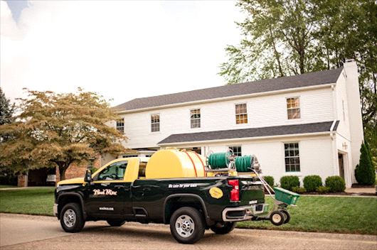 Weed Man truck outside of lawn